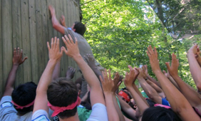 Students climb wall