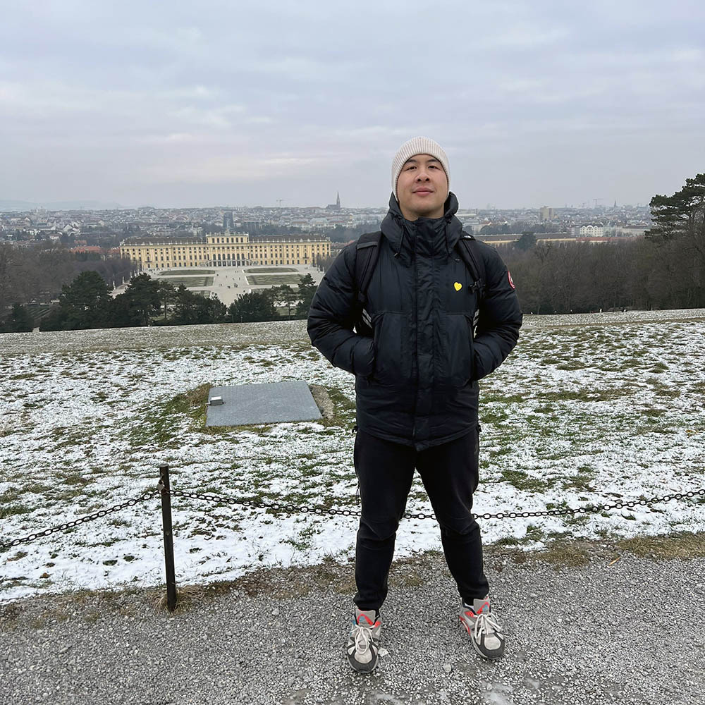 Louis Wu in Washington, D.C., snow is on the ground behind him