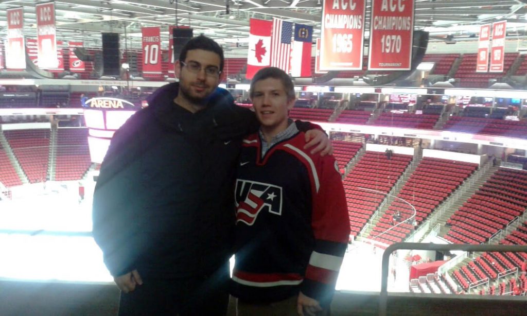 Students at a hockey game at PNC Arena