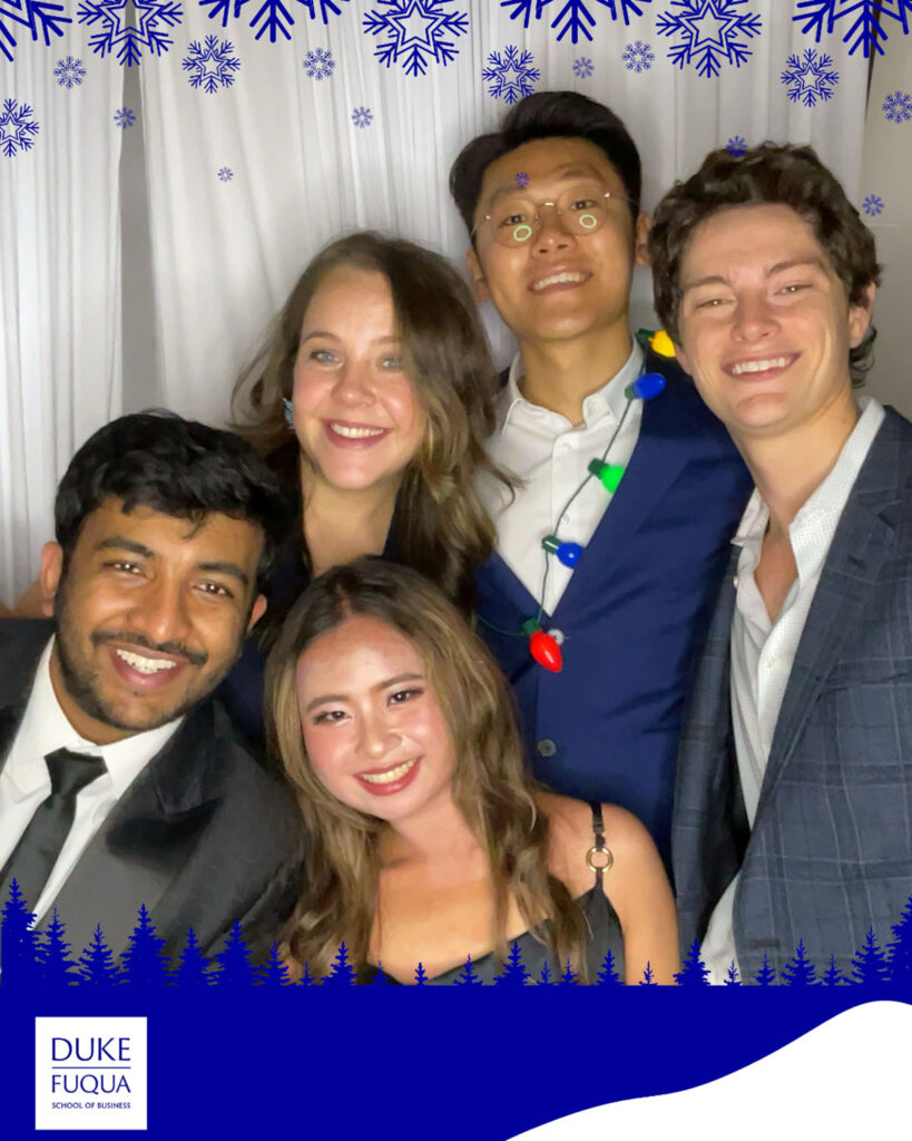 Gary Cui and other MMS fellows take photo in photo booth at MMS Winter Formal