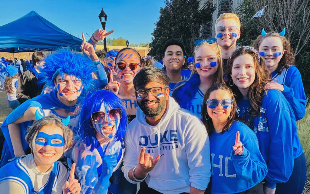 Chirayu Arya and other Blue Devil fans pose for photo outside Cameron Indoor Stadium