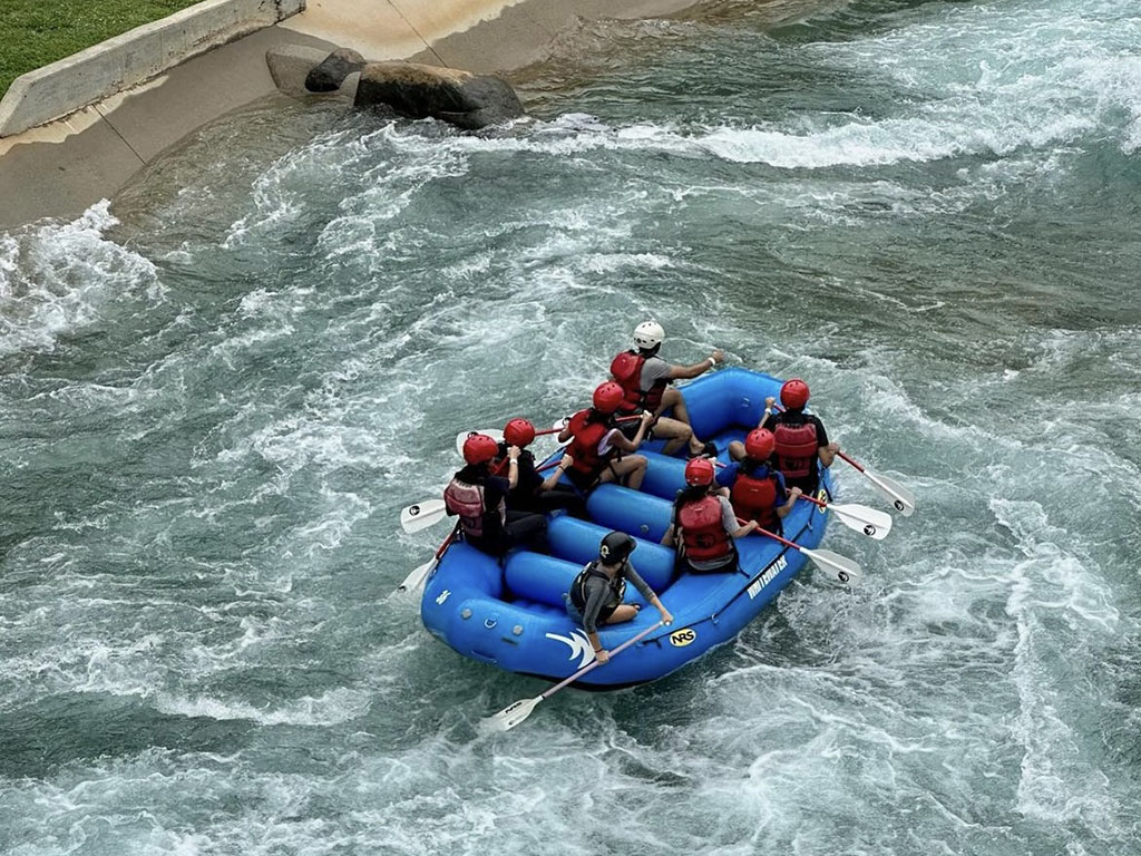 A group whitewater rafting, Aditi Achrekar, a MMS alumna, is on board