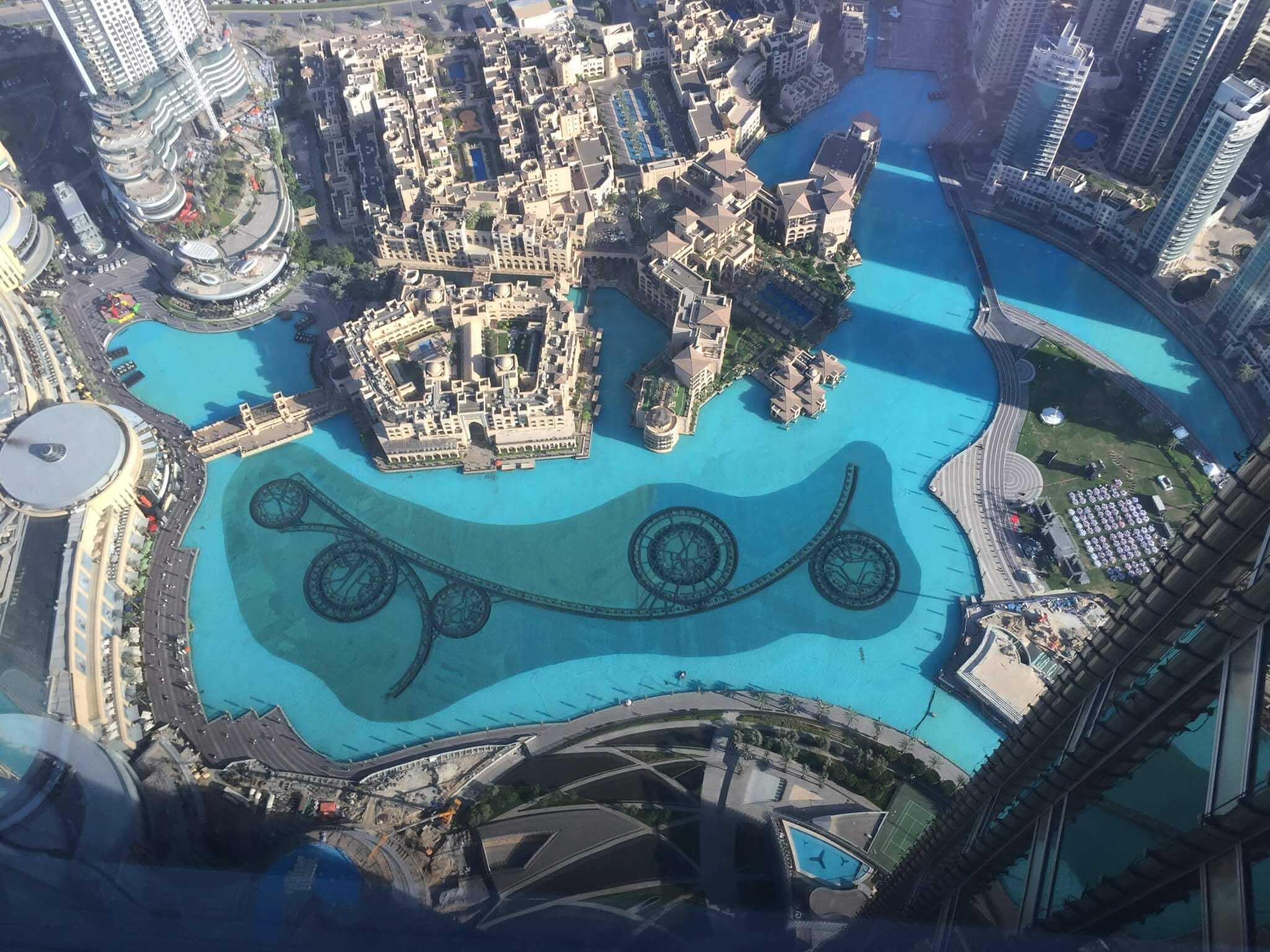 aerial view looking downward on buildings and water in Dubai 