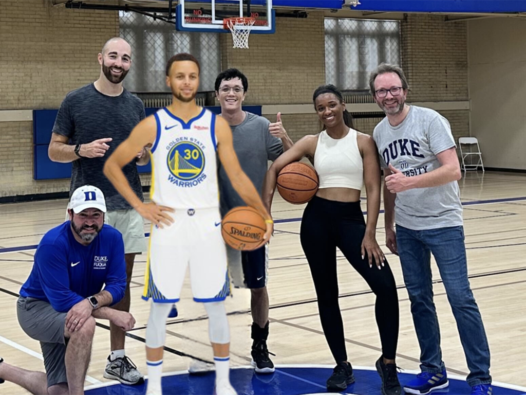 Trillion Small with a group of classmates at Cameron Indoor Stadium. Steph Curry is edited into the photo.