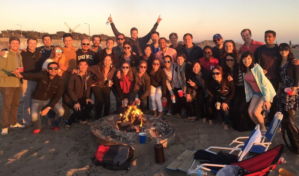 a few dozen people, students and others, enjoying the sunset in California, career in energy