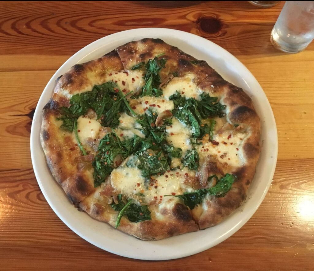Sausage and spinach pizza from Pizzeria Toro
