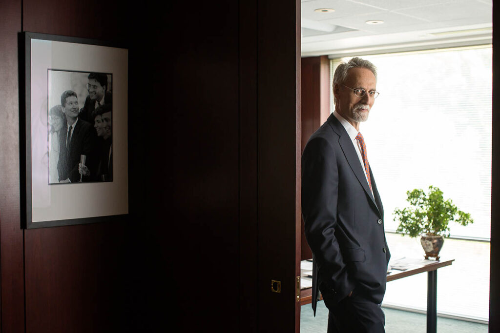 Dean Bill Boulding standing in his office, he believes in doing business better