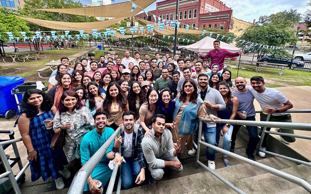 Dozens of Daytime MBA students, including Vertika Srivastava, gather in the outdoor patio of Bull McCabe's, a bar and restaurant in Durham, for the INDUS second-year mixer.