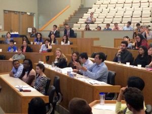 Professor Pranab Majumder asks a question after a presentation by Duke MMS Students in the Accenture Case Competition