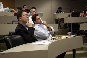 Professors Xu Jiang and Ramon Lecuona Torras sitting on the judge panel for the stock pitch competition