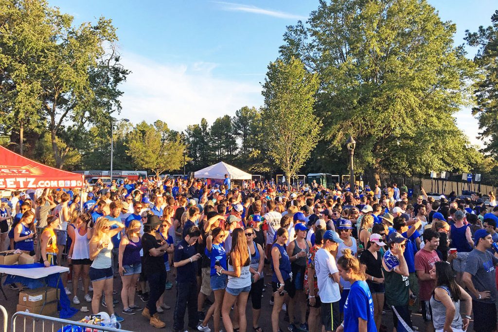 hundreds of students in a crowd at Campout, scenes of basketball at Duke
