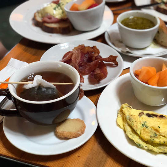 tea, bacon, an omelet, fruit and more at Guglhupf, one of Lily's brunch recommendations