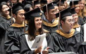 Graduates of the MMS: FOB program listening to a commencement speaker