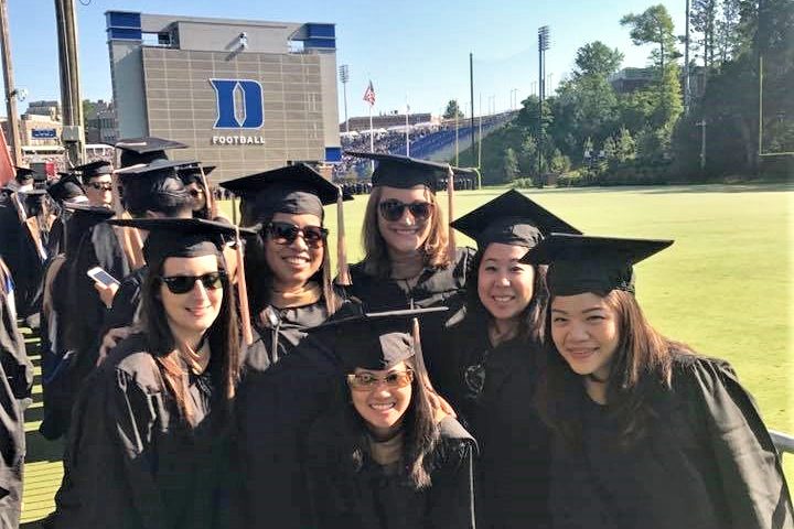 Me with a few classmates posing during graduation, was my MBA worth it