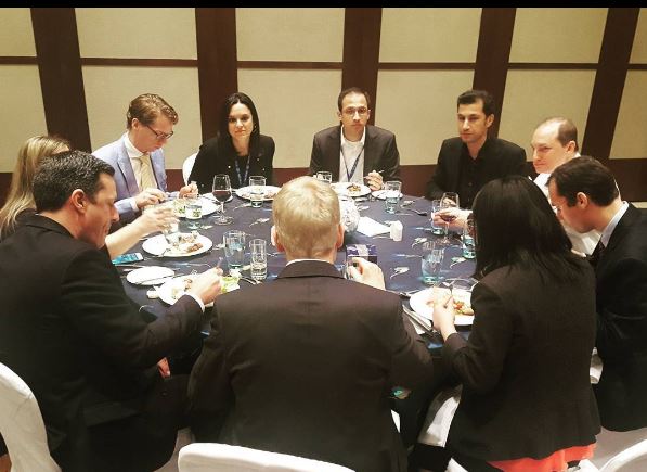 round table discussion at dinner, during a day in the life of a Global Executive MBA student