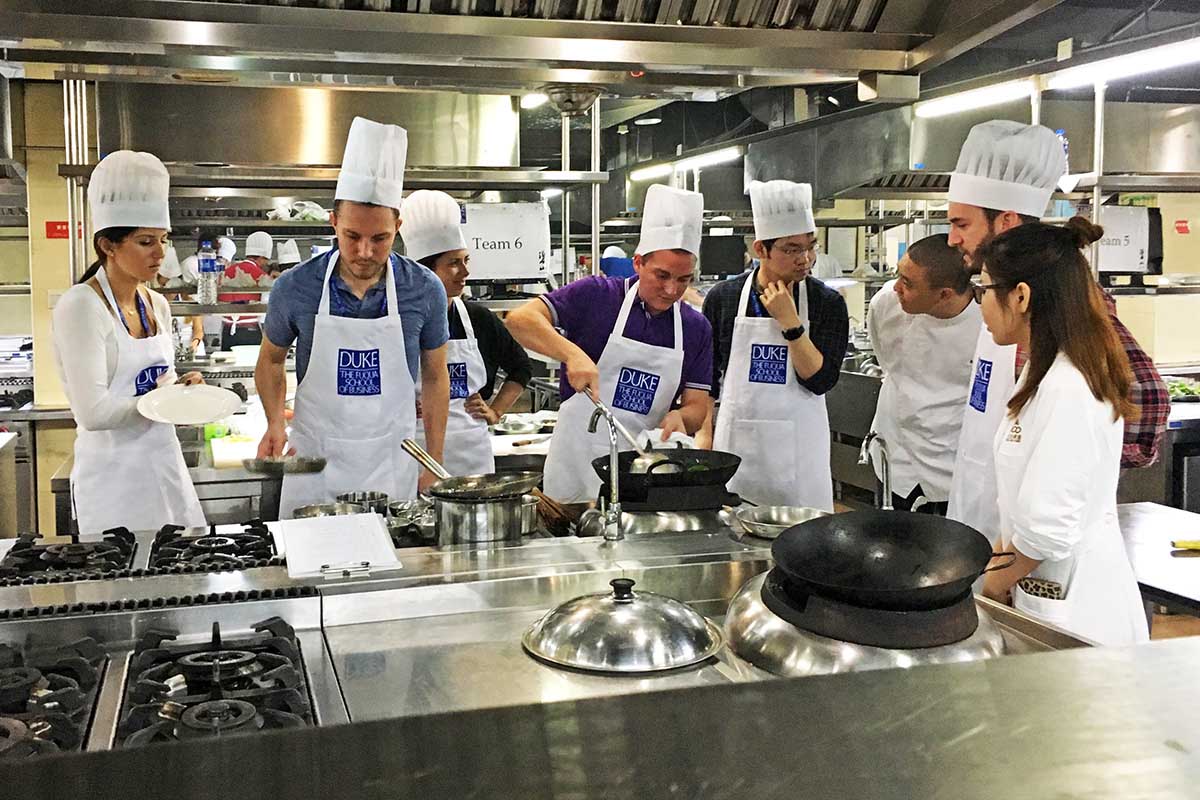 students cooking in the kitchen during a team exercise, things I learned in my MBA program