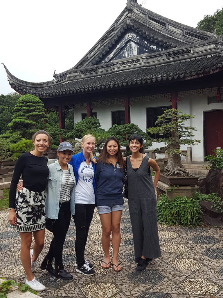 students in front of a traditional style building in East Asia, things I learned in my MBA program