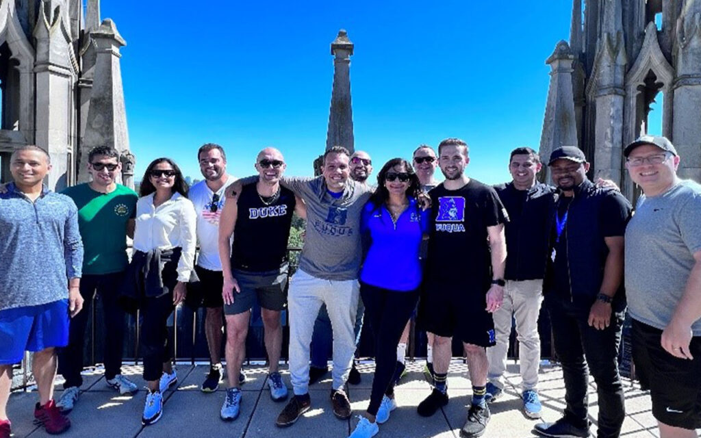 Group of Global Executive MBA students pose for photo after climbing Duke Chapel stairs