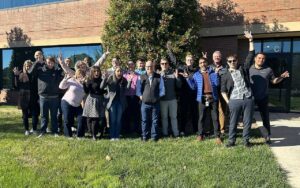 A group of Global Executive MBA students standing together outside a building