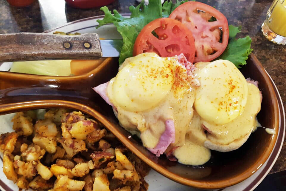 an eggs Benedict plate from Brigs in the Park, a great spot for brunch in Durham