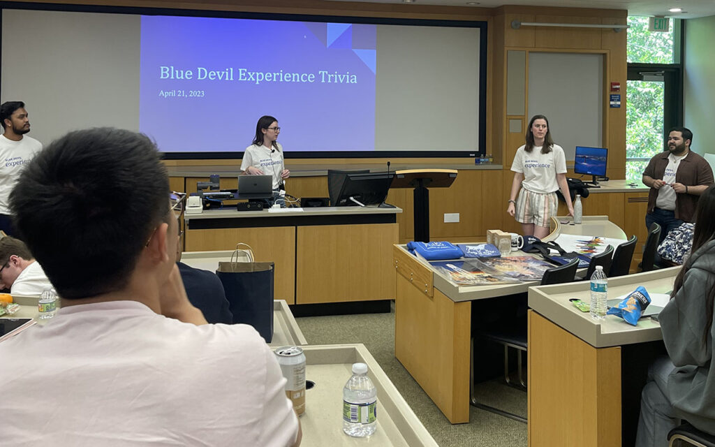 A group of MQM students and prospective students participating in trivia event during Blue Devil Experience at Duke University's Fuqua School of Business