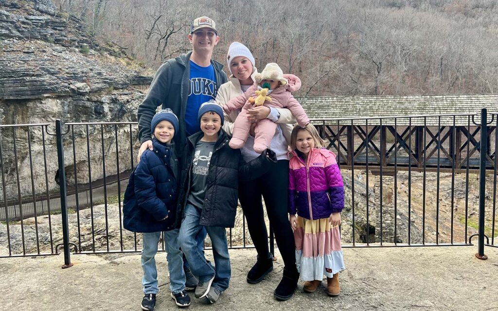 Joshua Duncan, a Fuqua alumnus, with his wife and four children